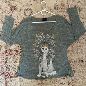 White cat wearing headdress top